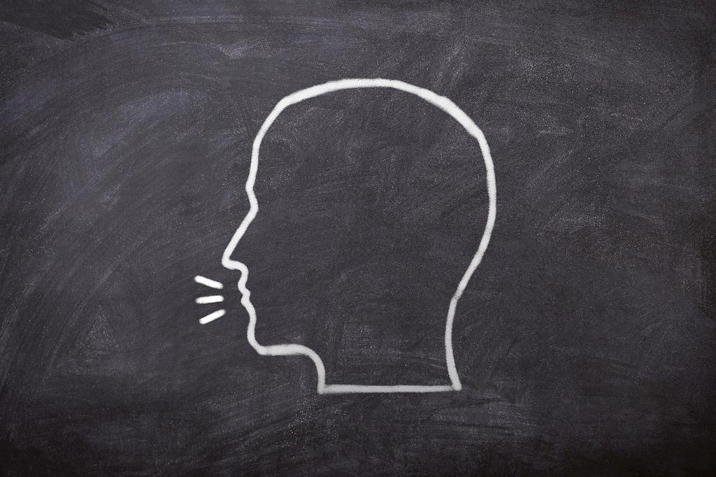 Speaker practicing breathing and vocal techniques
