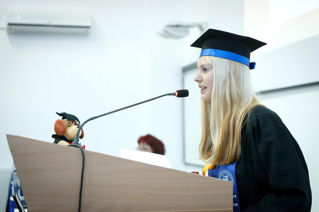 Speaker practicing delivery at a conference podium